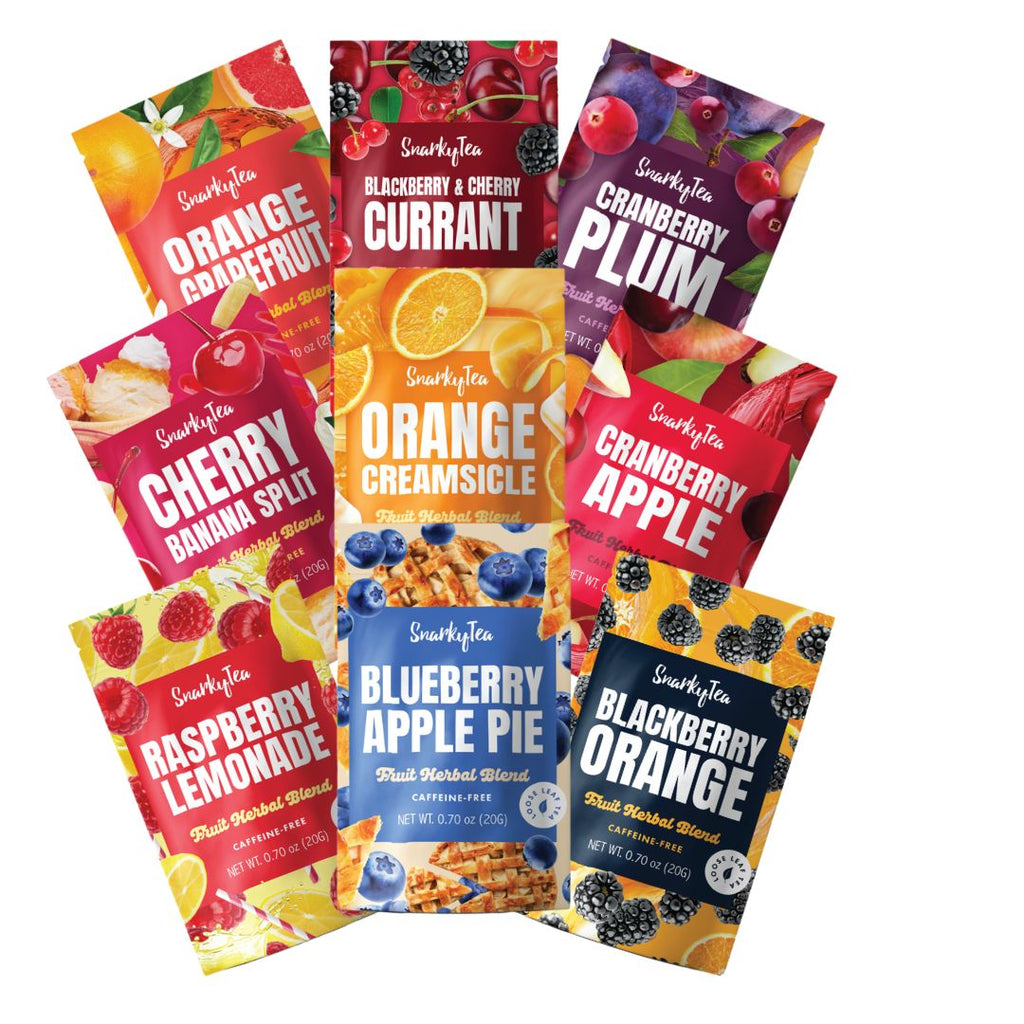 Assorted Snarky Tea fruit herbal blends displayed in colorful packets, including Orange Grapefruit, Blackberry & Cherry Currant, Cranberry Plum, Cherry Banana Split, Orange Creamsicle, Cranberry Apple, Raspberry Lemonade, Blueberry Apple Pie, and Blackberry Orange.