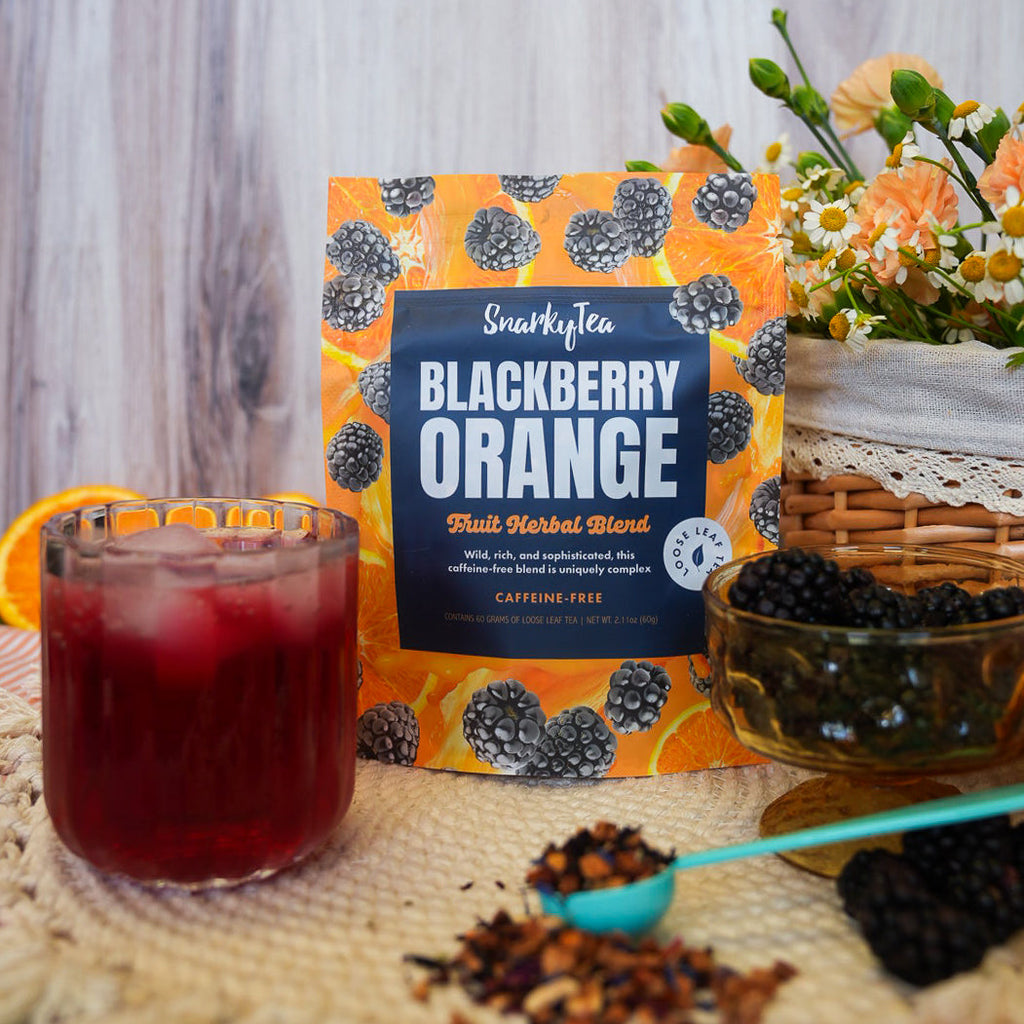 Packaging for Blackberry Orange fruit herbal blend tea by SnarkyTea, featuring images of blackberries and orange slices on the bag.