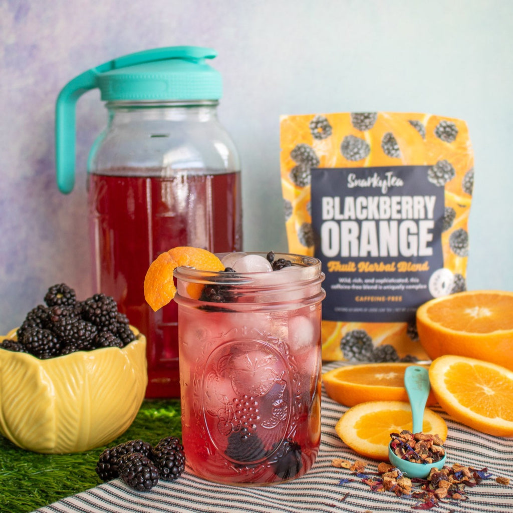 Packaging for Blackberry Orange fruit herbal blend tea by SnarkyTea, featuring images of blackberries and orange slices on the bag.