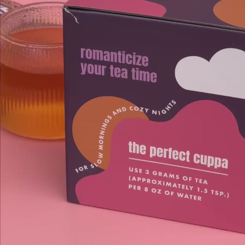 Video with unboxing of new steep dreams hot tea pot on a pink background.