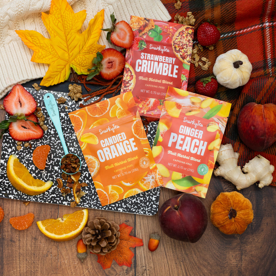A whitebox photo of the Upperclassmen Trio, consisting of Candied Orange, Ginger Peach, and Strawberry Crumble in 20g bags
